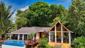 Relax At This Hillside Retreat That Overlooks The Lush Forest And The Caribbean