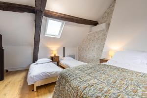 Maisons de vacances Charmant cottage renove et climatise, centre historique de Moret-sur-Loing : photos des chambres