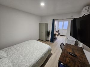 Appartements Cosy T1 au 14B avec Climatisation et Parking : photos des chambres