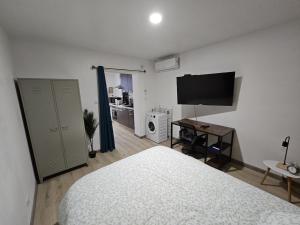 Appartements Cosy T1 au 14B avec Climatisation et Parking : photos des chambres
