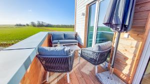 Deichbude Tossens - Modernes Ferienhaus für 4 Personen