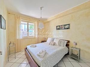 128 - Bilocale a Marcelli al Villaggio Rosa con portico e giardino, climatizzato - SPIAGGIA INCLUSA AL WHITE BEACH CLUB