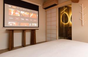 Appartements CEVA Suite Sakura - Jacuzzi & Cinema Centre ville : photos des chambres