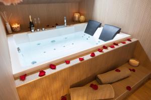 Appartements CEVA Suite Sakura - Jacuzzi & Cinema Centre ville : photos des chambres