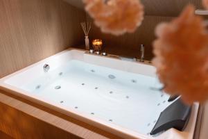 Appartements CEVA Suite Sakura - Jacuzzi & Cinema Centre ville : photos des chambres