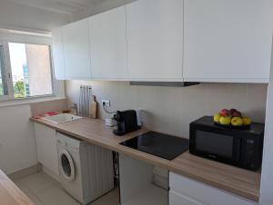 Appartements Vue imprenable sur Paris situe a Courbevoie - La Defense : photos des chambres