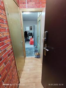 your room in a three-room apartment with a shared kitchen, bathroom, and toilet