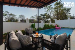 StayVista at Casa Ti Amo with WiFi, AC, Pool, BBQ
