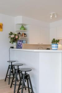 Huswell - Beachfront apartment with bike storage & terraces