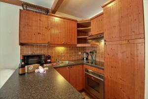 ARC 1950 - Appartement 10 personnes Duplex Cheminée - ski aux pieds - Sauna, Hammam, Jacuzzi, Piscine