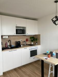 Appartements Cozy Home La Defense U Arena long sejour aussi : photos des chambres