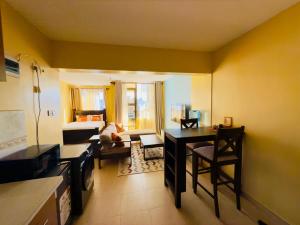 Deluxe studio with a balcony view overlooking the Nairobi town skyline