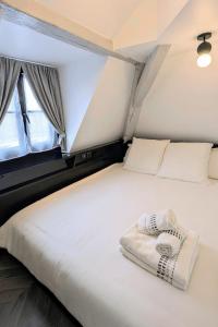 Appartements T2 au Coeur Historique de Dijon avec Clim & SmartTV : photos des chambres