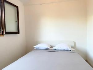 Villas Charmante maison avec jardin : photos des chambres
