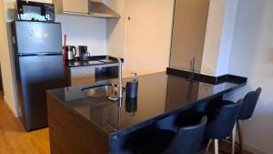 Tiza - Studio frente a Shopping