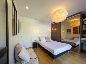 Villas Villa contemporaine avec piscine, vues panoramiques lac & montagnes, climatisation : photos des chambres