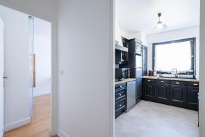 F2 moderne - 15 min Paris - Parking privé