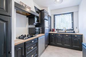 Appartements F2 moderne - 15 min Paris - Parking prive : photos des chambres
