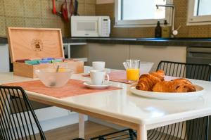 Appartements Chez Flo - clim parking - clg : photos des chambres