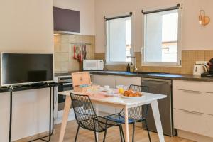 Appartements Chez Flo - clim parking - clg : photos des chambres