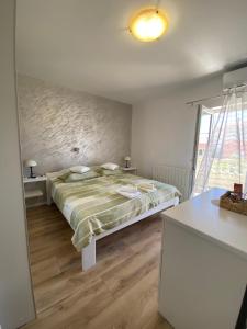 Double Room with Balcony room in Apartments and rooms by the sea Palit Rab - 5010