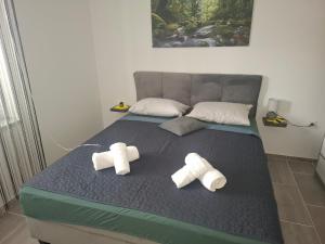 Apartments with parking space Palit, Rab - 24800