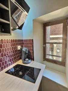 Appartements La Cour des Secrets- Hyper Centre : photos des chambres