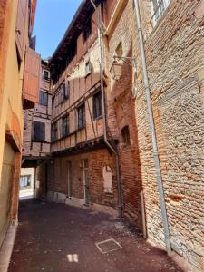 Appartements La Cour des Secrets- Hyper Centre : photos des chambres