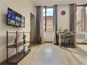 Appartements La Cour des Secrets- Hyper Centre : photos des chambres