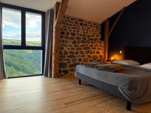 Maisons de vacances Gite LE RABIOUZE - 4 epis, 15 pers, 22 couchages - Ancienne Bergerie renovee, cachet d-origine conserve - Vue magnifique - Label Ecogite : photos des chambres
