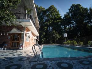 Blue Lagoon Shared Villa by Homeyhuts-1BR Dehradun