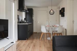 Vrolijk chalet met hottub & omheinde tuin VP094