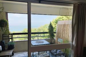 Appartements Aux Flots Bleus avec balcon et vue sur mer : photos des chambres