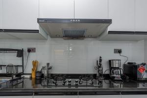 furnished two bedroom apartment with swimming pool, fully equipped gym, private parking space ,children playground and unbeatable scenic city views in kilimani