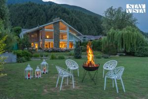 StayVista at The Nestled North with Bonfire, lawn