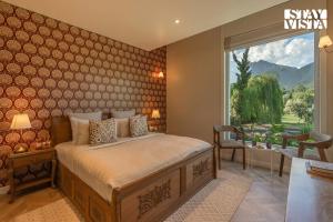 StayVista at The Nestled North with Bonfire, lawn