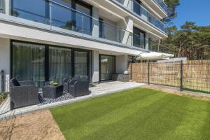 Urokliwy Apartament z Ogródkiem 150 m od Plaży Parking Międzywodzie by Noclegi Renters