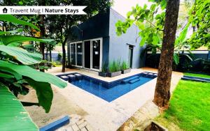 The Calms Villa by Travent Mug