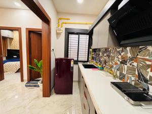 HomeEscape Elite 1BHK - Mahalaxmi Nagar 201
