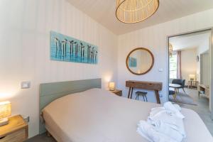 Appartements Domaine du Flamand - Gites du Flamand cote Piscine : photos des chambres