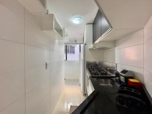 Apartamento no centro, 2 quadras do mar com ar condicionado, vaga de garagem e elevador
