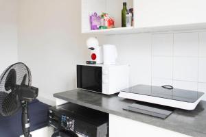 Appartements Cosy fully-equipped studio near Paris : photos des chambres