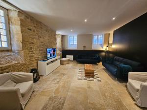 Appartements LA MAISON VALENTIN AU COEUR DE LA CITE MEDIEVALE : photos des chambres