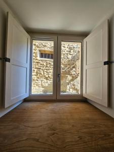 Appartements LA MAISON VALENTIN AU COEUR DE LA CITE MEDIEVALE : photos des chambres