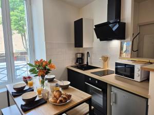 Appartements T2 Cosy Centre ville Clim & Wifi : photos des chambres