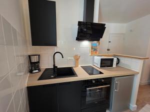 Appartements T2 Cosy Centre ville Clim & Wifi : photos des chambres