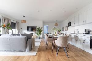 Earthy Ground Floor Home with Patio Sunbeds Greenery