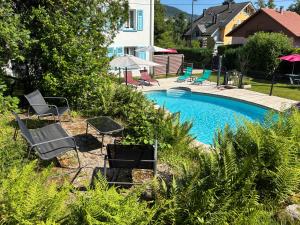 Appartements Les 4 flocons, avec piscine exterieure chauffee a 100m du lac et du centre , wifi, parking, sauna : photos des chambres