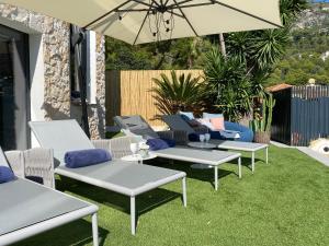 Appartements Un coin de paradis avec vue Mer et jardin : photos des chambres