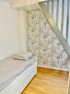 Maisons de vacances Charmante maison triplexe avec jardinet : photos des chambres